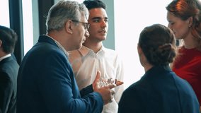 Businessman enjoy discussing with business partner at corporate networking event or office New year party. Company meeting, Team collaboration, Employee and customer gathering - Powered by Shutterstock - Get 15% off with code: PIKWIZARD15