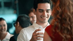 Smiling man enjoy tallking and toasting drink with customer woman at the company New year party. Successful project celebration. Office business meeting. Social gathering event - Powered by Shutterstock - Get 15% off with code: PIKWIZARD15