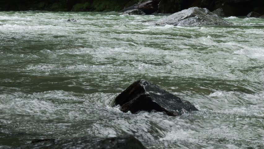 Rocks And Rapids In River In Haast, New Zealand - Wide Shot