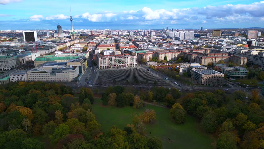 Berlin cityscape Holocaust Memorial at autumn. Dramatic aerial view flight drone