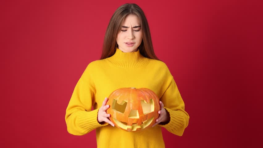Happy Halloween. Woman with carved Jack-o