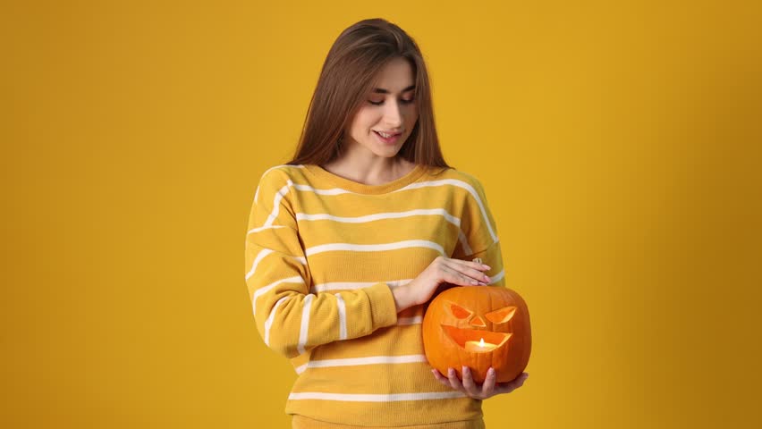 Happy Halloween. Woman with carved Jack-o