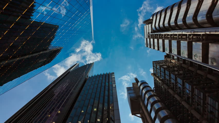 Bottom-up wide angle shot of important and futuristic skyscrapers in the financial center of a large metropolis
