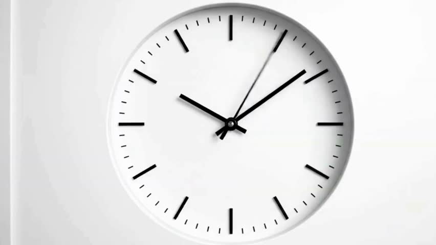 A clean, minimalist white analog wall clock with black hands displayed against a plain white background, perfect for concepts of time, punctuality, or modern interior design visuals.