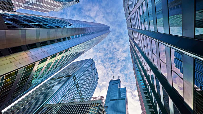 Modern corporate building shot from below in stunning 4K, symbolizing growth, success, ambition, and innovation — perfect for business, finance, and corporate concept videos.