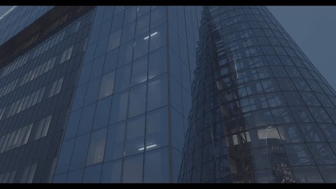 Aerial Vertical Rise near Modern Glass Building