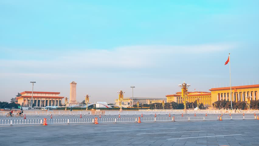 Atmospheric panoramic view of Tiananmen Square in Beijing, China showcasing iconic government buildings and vast stone plaza under dramatic sky