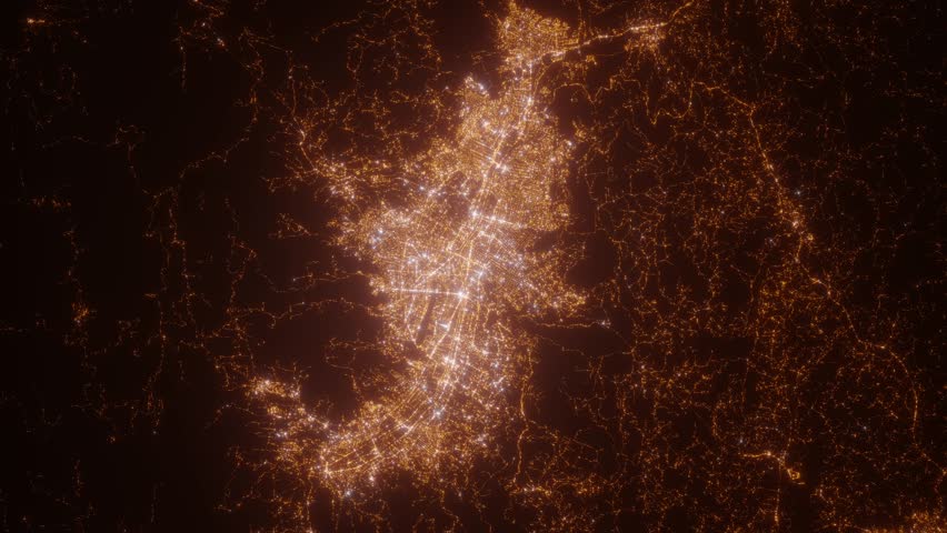 Medellin (Colombia) aerial view at night. Top view on modern city with street lights. Camera is zooming out, rotating clockwise