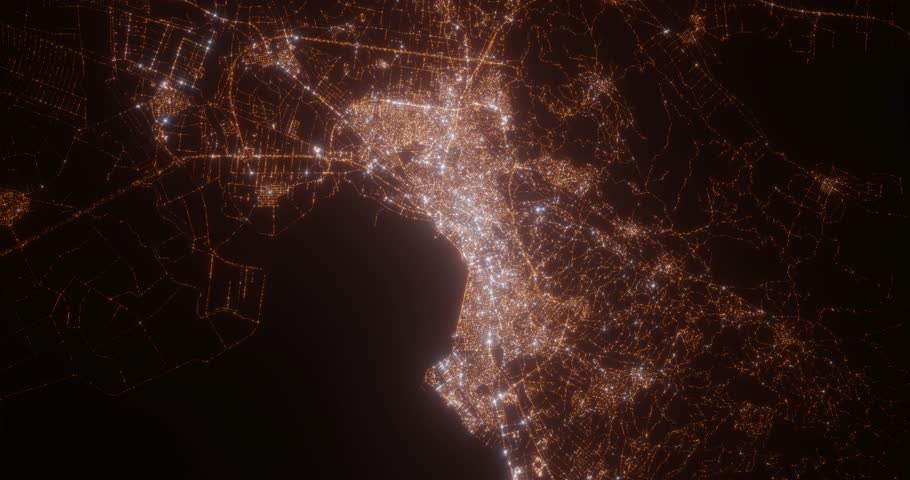 Thessaloniki (Greece) aerial view at night. Top view on modern city with street lights. Camera is zooming out, rotating clockwise