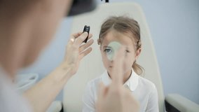 Doctor examining child eye with optical lens - Powered by Shutterstock - Get 15% off with code: PIKWIZARD15