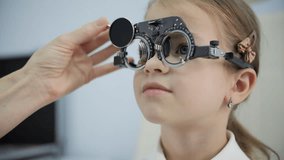 Optometrist adjusting test glasses for eye examination - Powered by Shutterstock - Get 15% off with code: PIKWIZARD15