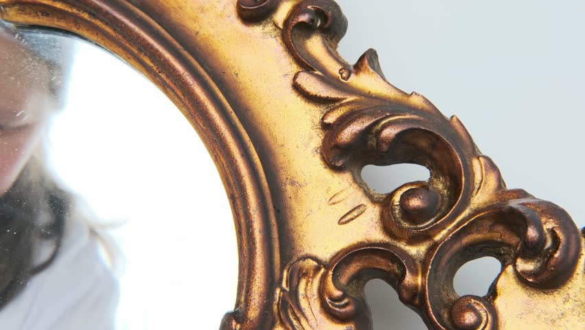 Antique artwork detail, restorer working with brush, gold frame cleaning, closeup historical artifact before sale, art object ready for expert evaluation and auction