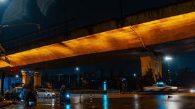 Illuminated highway viaduct at night in Hangzhou with wet pavement reflecting lights from passing traffic and street lamps creating dramatic urban atmosphere - Powered by Shutterstock - Get 15% off with code: PIKWIZARD15