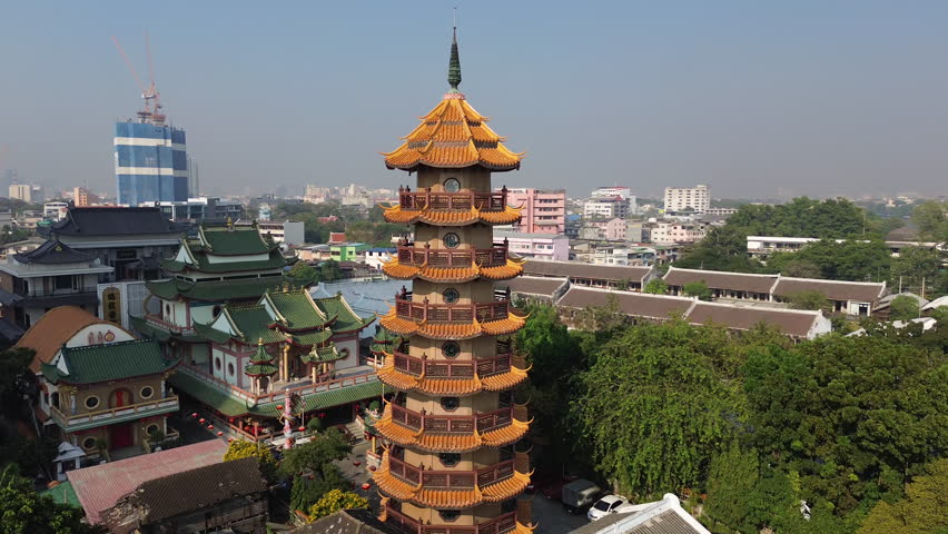 Aerial around view of Wat Che Chin Koh temple tower, Bangkok, Thailand, 4k