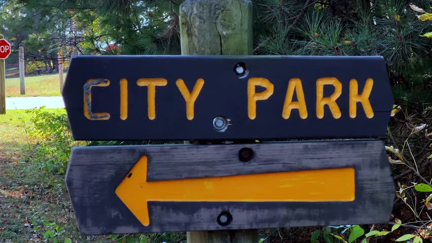 A wooden sign for a City Park, is seen along the Paul Bunyan Trail in Nisswa, Minnesota.