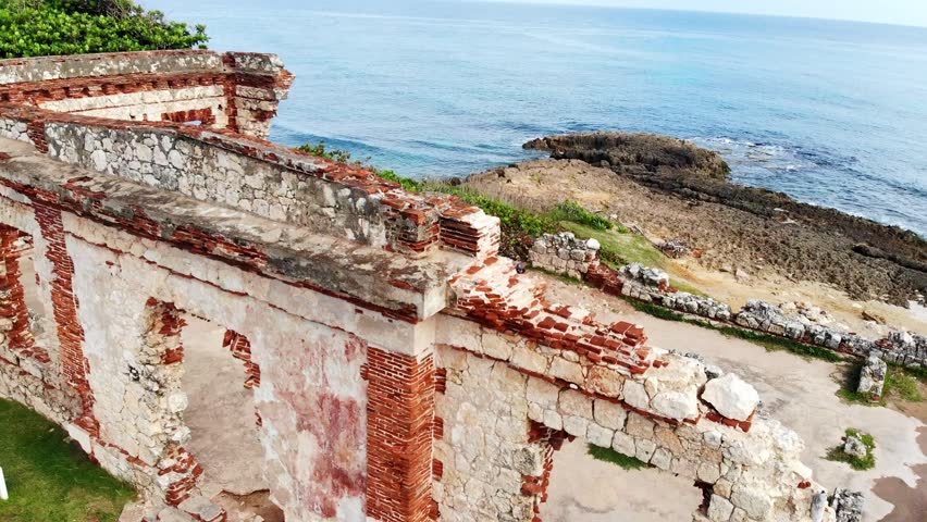 Aerial (drone) view of the ruins of the Spanish lighthouse at Punta Borinquen beach, Aguadilla, Puerto Rico	