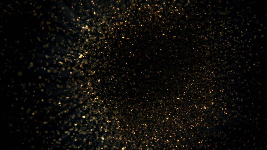 Super Slow Motion Shot of Rotating Golden Glitters Towards Camera Isolated on Black 1000fps.