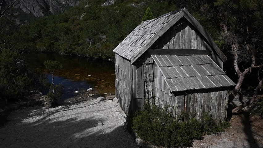 boat shed at crater lake along the hiking trail through the dense idyllic rainforest of Cradle mountain, a popular travel destination for hiking and outdoor sports activities in Tasmania, Australia.
