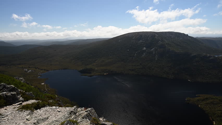 view over lakes and forests and with lush green vegetation of beautiful landscape cradle mountain in Tasmania, a popular travel destination for hiking and other outdoor activities in Australia.