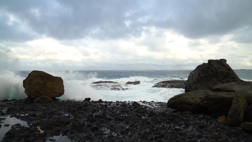 Hualian Shimen Sea Erosion Cave, Shimen Cave (March Cave), Taiwan. Waves crash against the rocks