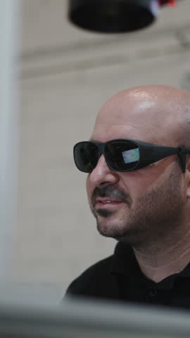 Laser welding operator working with protective glasses