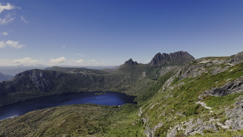 view over dove lake and forests and with lush green vegetation of beautiful landscape cradle mountain in Tasmania, a popular travel destination for hiking and other outdoor activities in Australia.