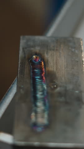 Colorful tig welding seam on metal plate