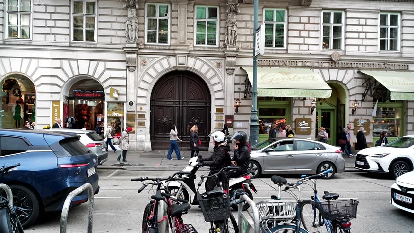 Vienna, Austria - 10.15.2025: Herbert-von-Karajan-Platz square, the location where the video was filmed, is in close proximity to the Vienna State Opera. 