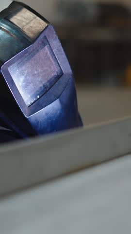 Close up of a welding helmet in a metalworking workshop