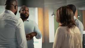 Multiethnic staff proud of their successful teamwork collaboration, clapping hands after business analysis. Employees use data visualization and forecasting for project objectives. Camera B. - Powered by Shutterstock - Get 15% off with code: PIKWIZARD15