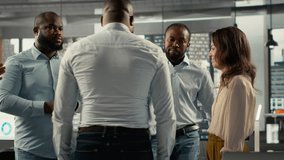 Business people celebrating their teamwork reviewing files and diagrams in a collaborative office. Work team aligns strategy and management with goals and insights for improved performance. Camera B. - Powered by Shutterstock - Get 15% off with code: PIKWIZARD15