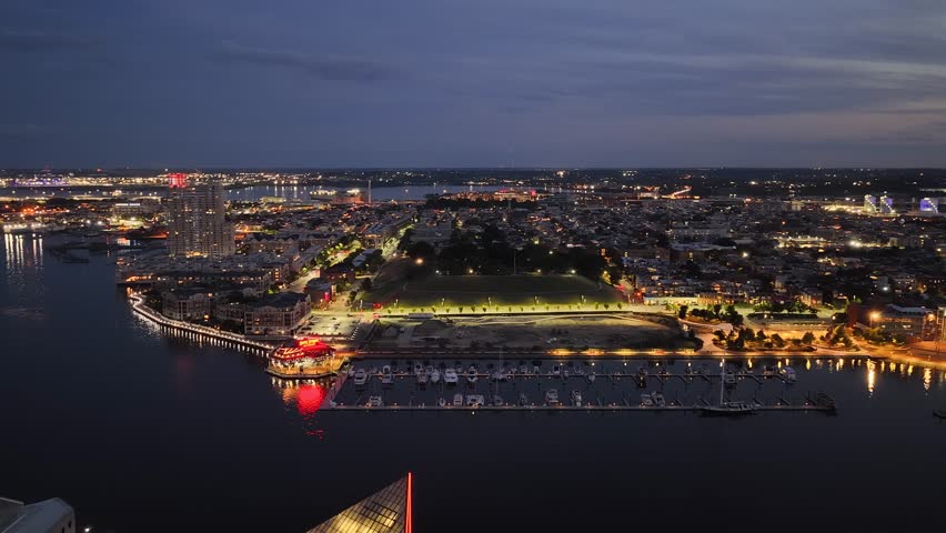 Baltimore Maryland USA - 8 25 2025: Aerial footage of skyscrapers and office buildings in the skyline along the Patapsco River in Baltimore Maryland USA