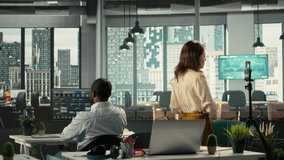 Corporate staff filming a video advertisement for a commercial in office, collaborating on data visualization and report sharing. Work team discusses resource allocation and targets. Camera B. - Powered by Shutterstock - Get 15% off with code: PIKWIZARD15