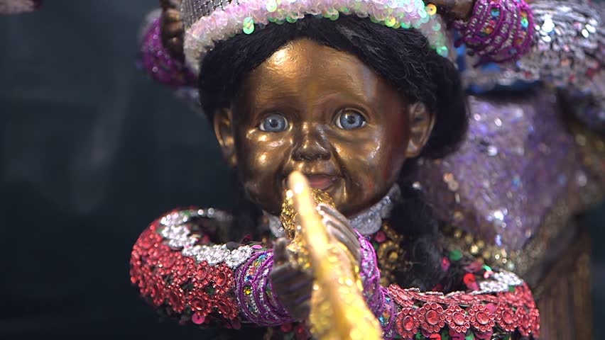 Port-au-Prince, Haiti - February 25 2019 - Doll painted with gold paint and dressed in rich finery, for a voodoo ceremony