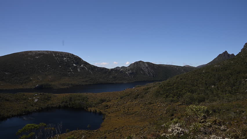 view over dove lake and forests and with lush green vegetation of beautiful landscape cradle mountain in Tasmania, a popular travel destination for hiking and other outdoor activities in Australia.