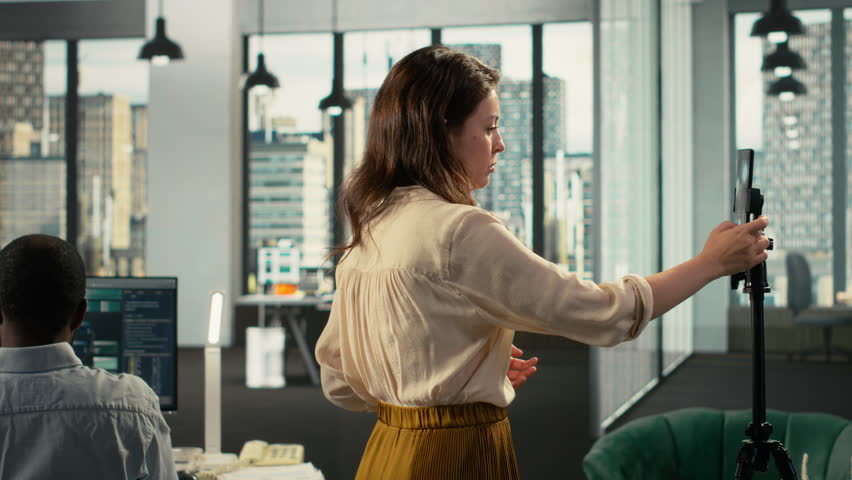 Coworkers broadcasting an advertising vlog for business marketing, reviewing documentation and analytics. Professional office highlights data visualization and forecasting within corporate. Camera B. - Powered by Shutterstock - Get 15% off with code: PIKWIZARD15