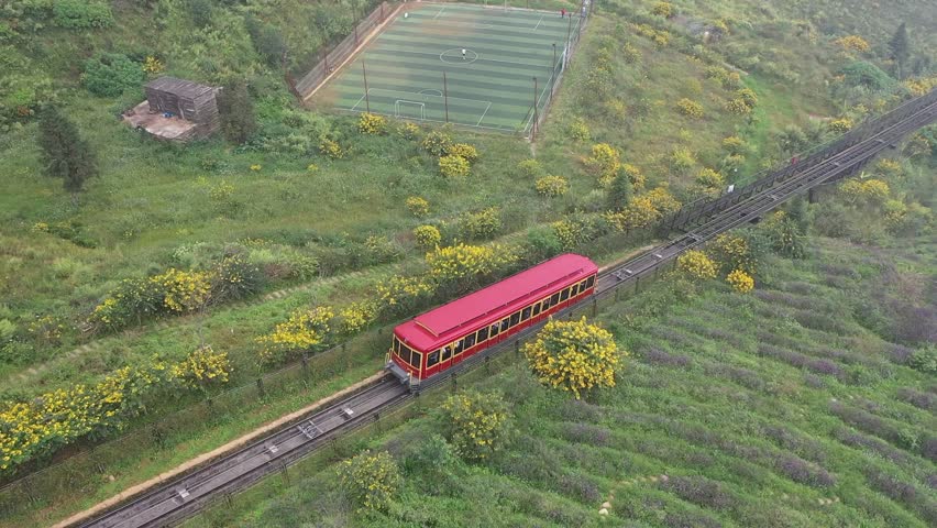 4k video. "Sapa red train" likely refers to the Muong Hoa Mountain Train, a scenic funicular in Sapa, Vietnam, that connects the town center to the Fansipan Cable Car station.