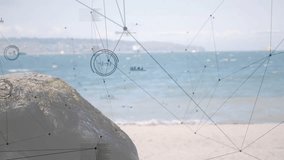 Digital nodes fading in starting network overlay on rock and beach while HUDs updating data trends. Coastal, data visualization, technology, natural landscape, futuristic, serenity, connectivity - Powered by Shutterstock - Get 15% off with code: PIKWIZARD15