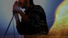 Vocalist holding mic singing in studio, creating light leak overlay then receding for music impact. Performance, musician, vintage, artistic, emotion, atmosphere, stage - Powered by Shutterstock - Get 15% off with code: PIKWIZARD15