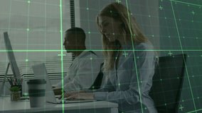 two colleagues starting typing at laptops activating green grid overlay simulating data analysis. Technology, productivity, teamwork, innovation, digital, corporate, modern - Powered by Shutterstock - Get 15% off with code: PIKWIZARD15