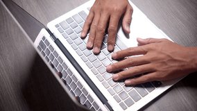 Closeup of Hands Typing Quickly on a Modern Laptop Keyboard on a Grey Desk - Powered by Shutterstock - Get 15% off with code: PIKWIZARD15