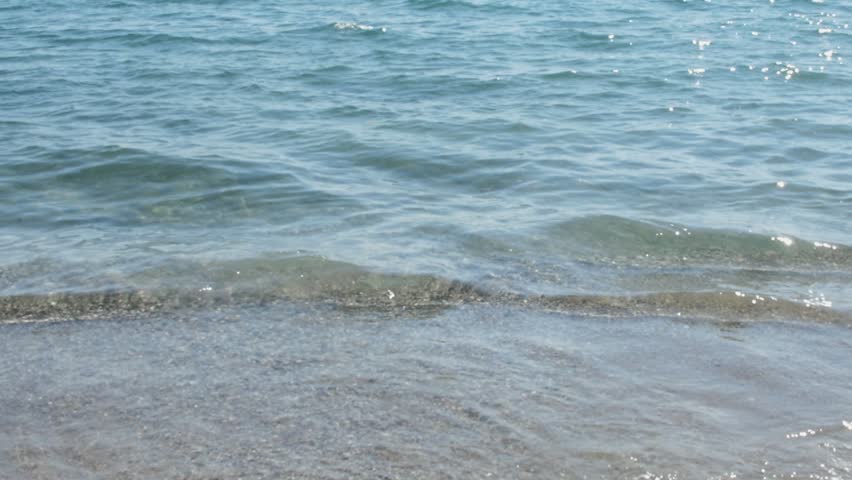 Relaxing water texture loop showing the constant, rhythmic motion of the ocean meeting the beach.