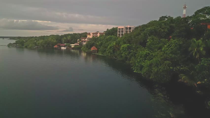 Lakeside Amainah Bacalar Luxury Boutique Hotel In The Bacalar Lagoon In Mexico. Aerial Ascending Shot