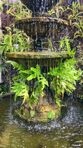 Fountain with water drops in a garden