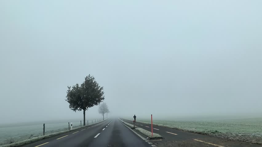 Driving through mist during early winter at Tafers, Fribough, Switzerland.