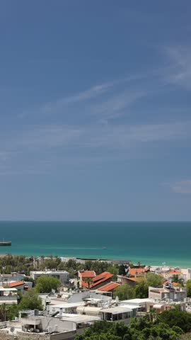 Timelapse vertical view of Ashdod sea shore , Israel at summer sunny day