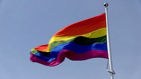 Vibrant rainbow flag waving proudly, symbolizing LGBTQ+ pride, unity, and the global movement for equality and acceptance. - Powered by Shutterstock - Get 15% off with code: PIKWIZARD15