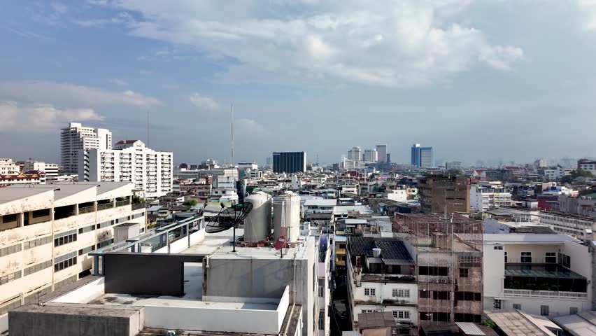 Panoramic Bangkok cityscape showing rooftop view and dense urban blocks near Samphanthawong District.