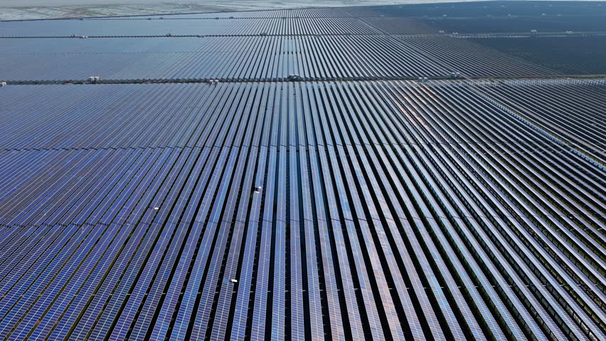 Aerial view of a solar panel power station on the water