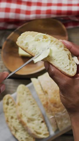 Slicing bread, hands holding knife with profile icon animation over kitchen scene. Cooking, culinary, food preparation